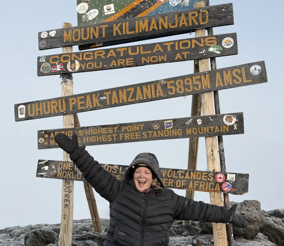Megan Wheatley at the top of Mount Kilimanjaro