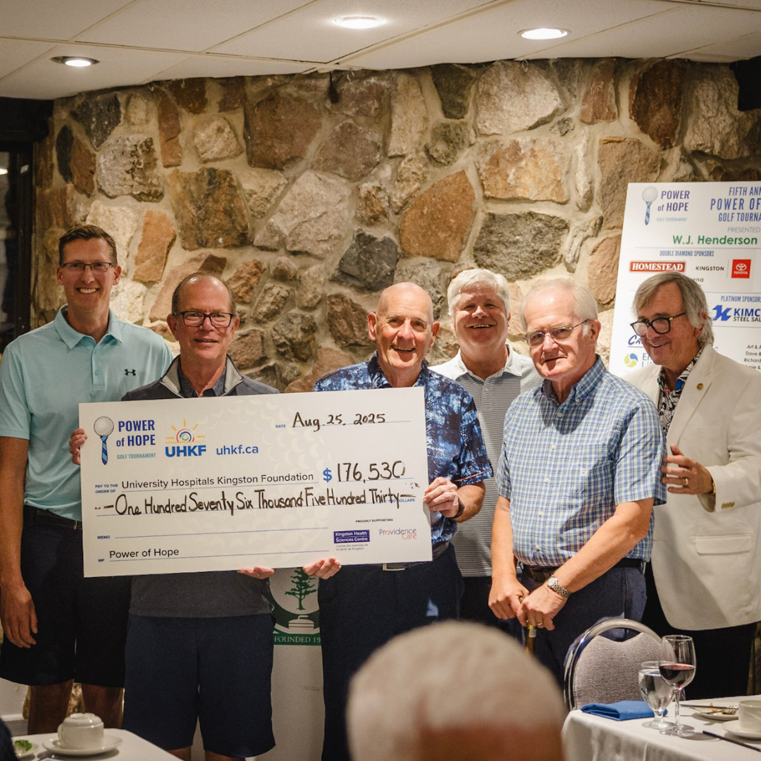 Power of Hope Committee presenting cheque.