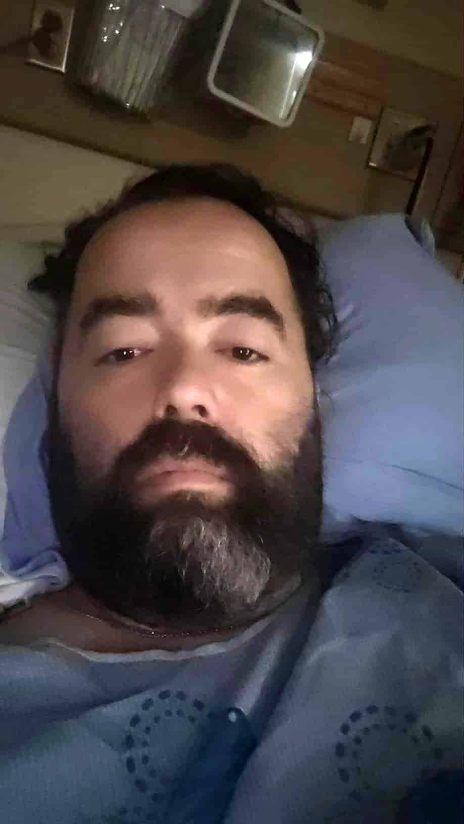 Corey Dunn in bed during recovery at KGH.