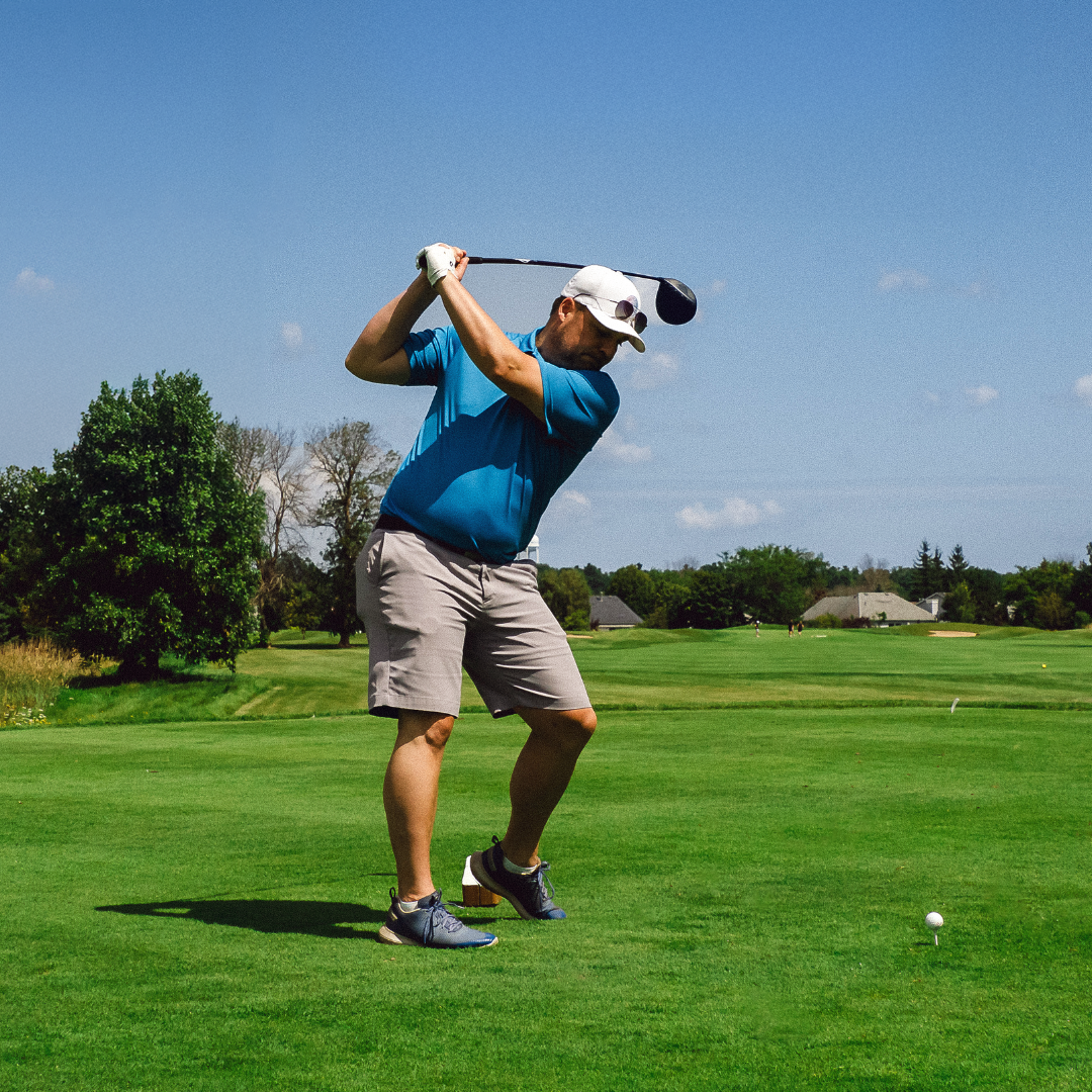 Greg Brown golfing at YGK golf tournament