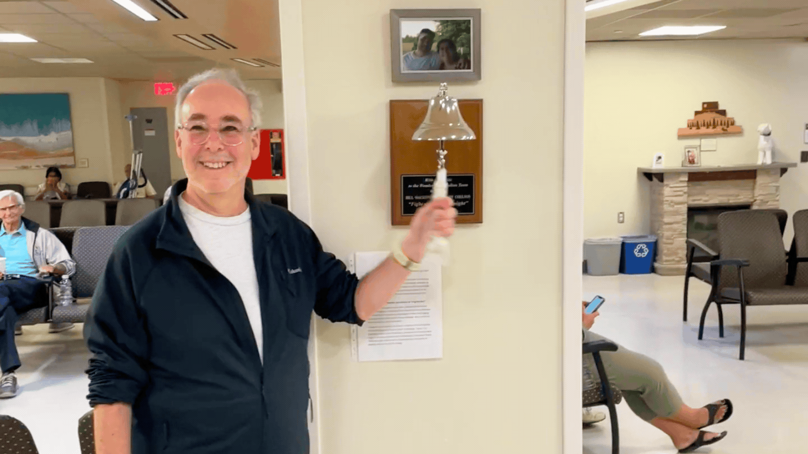 John ringing the bell at KHSC's Cancer Centre of Southeastern Ontario, signifying his official completion and success of treatment.