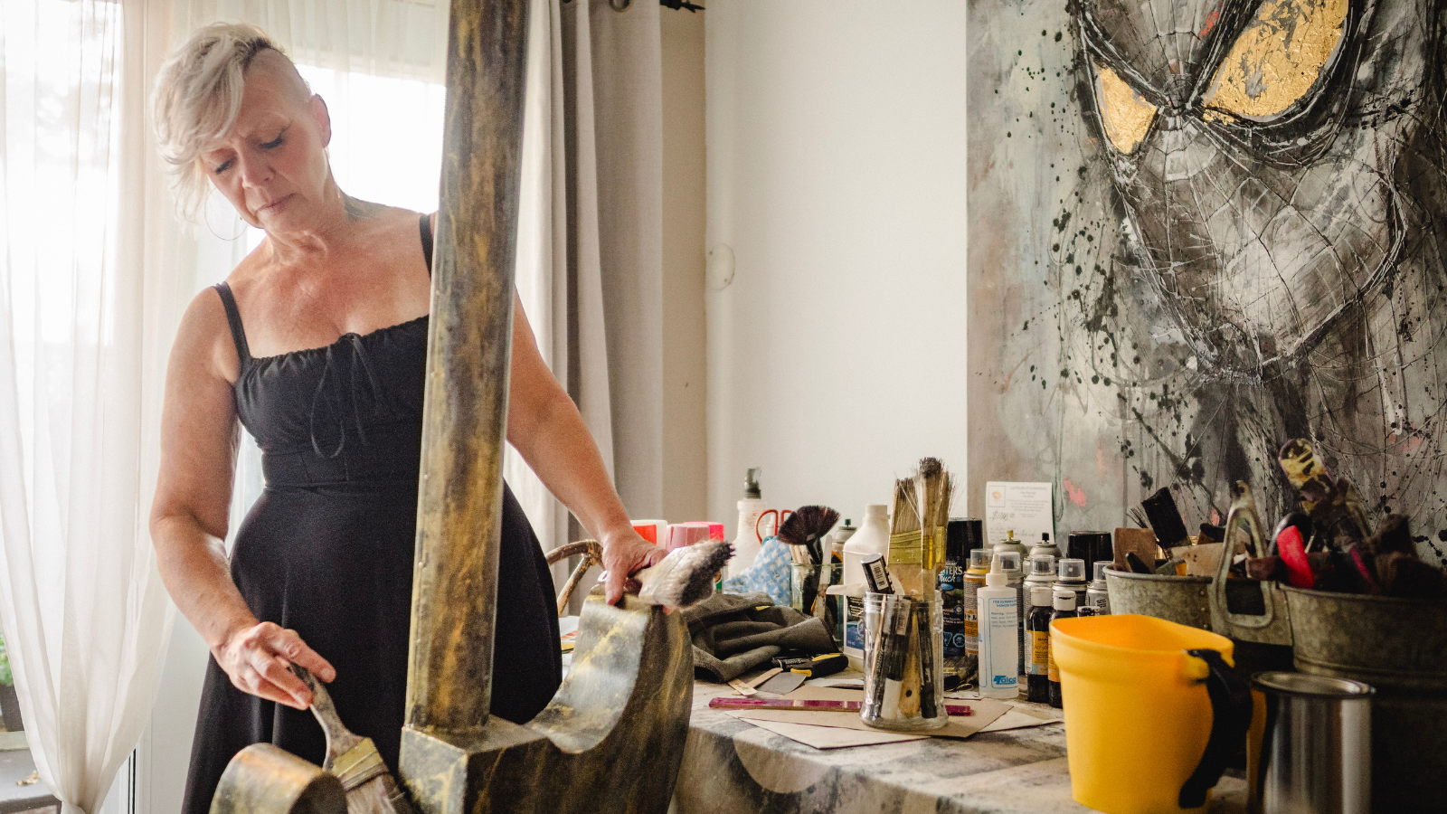 Cher Reynolds creating the guitar in her home art studio.