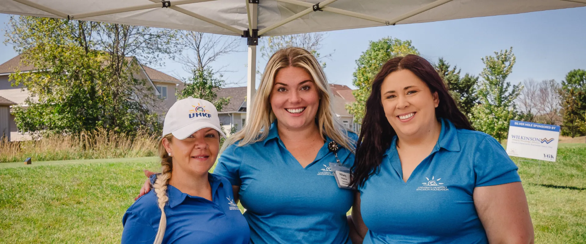 YGK Healthcare Champions Sasha, Hillary and Krista at the second annual golf tournament in blue golf shirts.