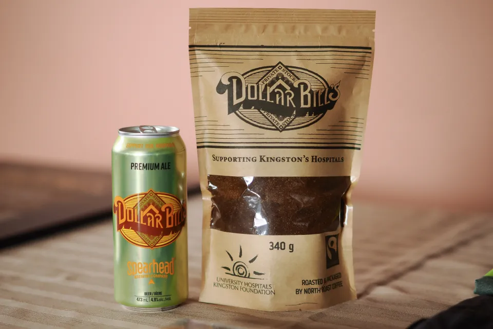 Dollar Bills coffee bag and Dollar Bills beer can on display.