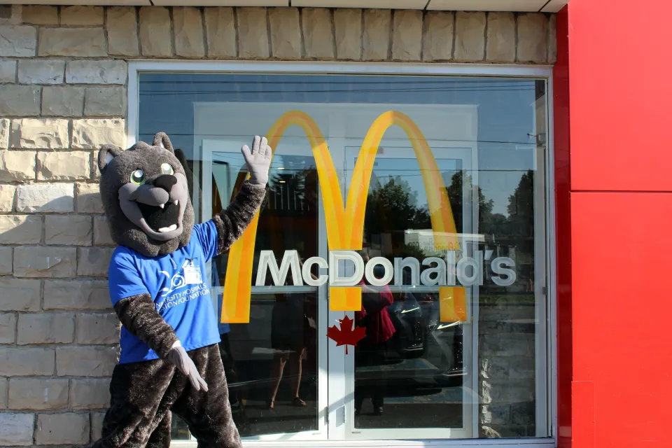 Asher standing outside of McDonalds