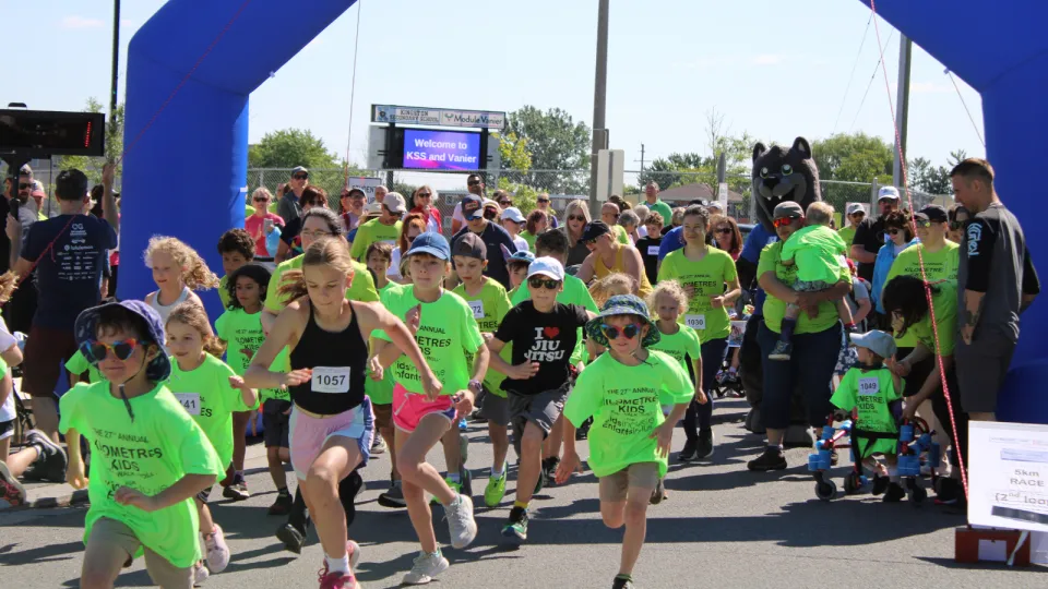 Kids in green t-shirts at Kilometres for Kids