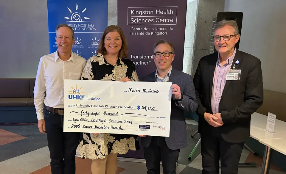 Dr Greg Davies, Dr Stephanie Sibley, Dr Gord Boyd & Dr Michael Fitzpatrick holding a big cheque.