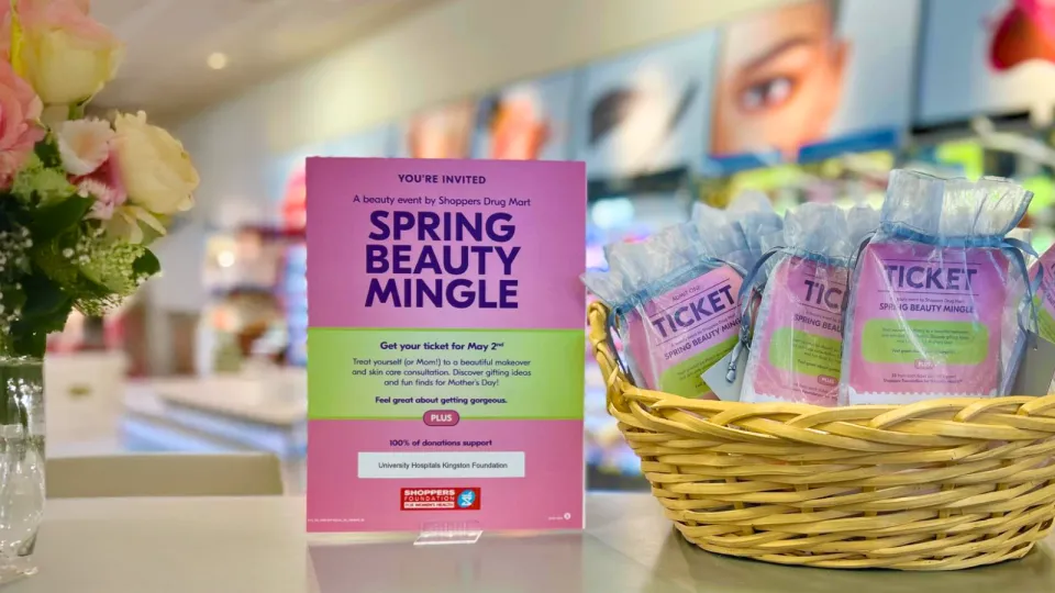Shoppers Spring Beauty Mingle signage on desk at store.