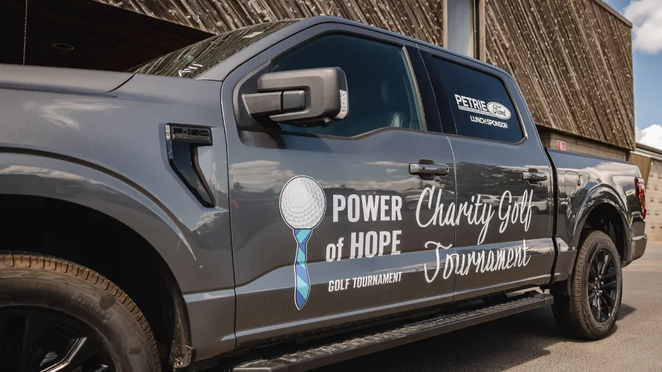 Grey pick up trunk with Power of Hope decal.