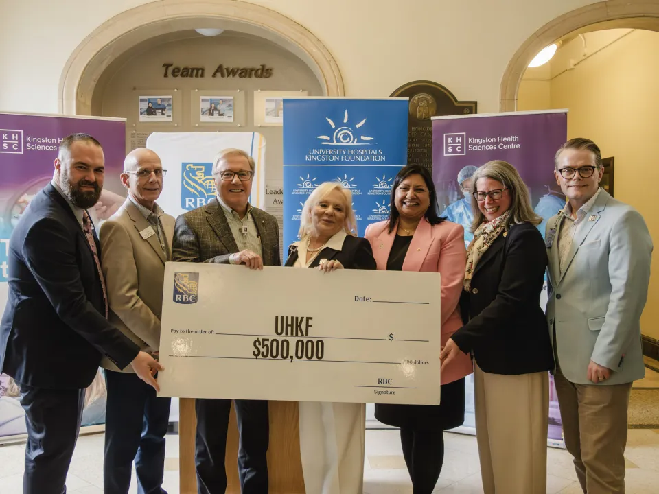 RBC, UHKF and KHSC executives holding a large cheque