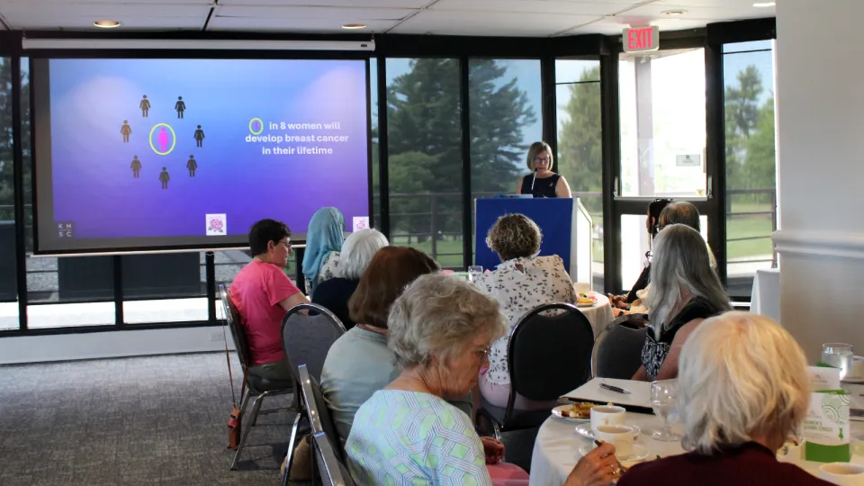 Dr. Doris Jans presenting at Women's Giving Circle luncheon.