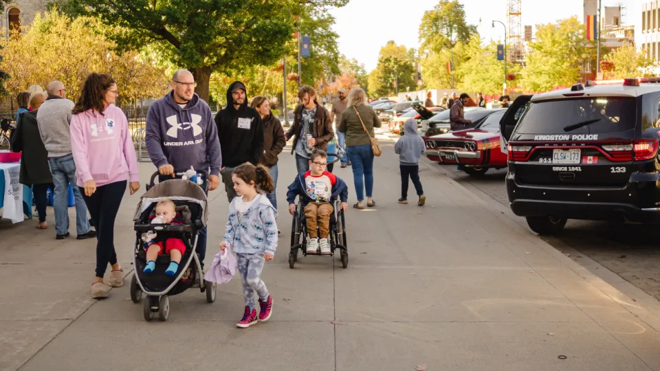 Families walking around car show