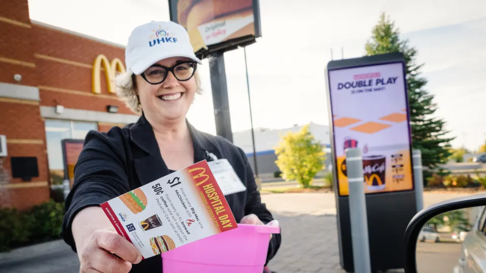 Lisa handing out flyers at McDonald's Day