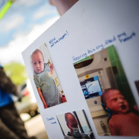 Mending Hearts with Declyn poster board with photos of baby Declyn in the NICU.