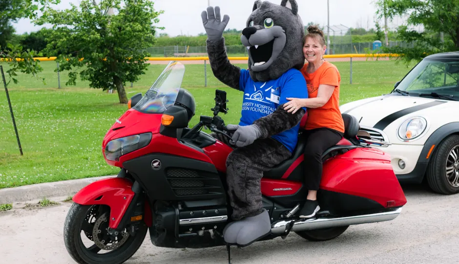 UHKF mascot Asher with Ride for Dad organizer Marion Perry