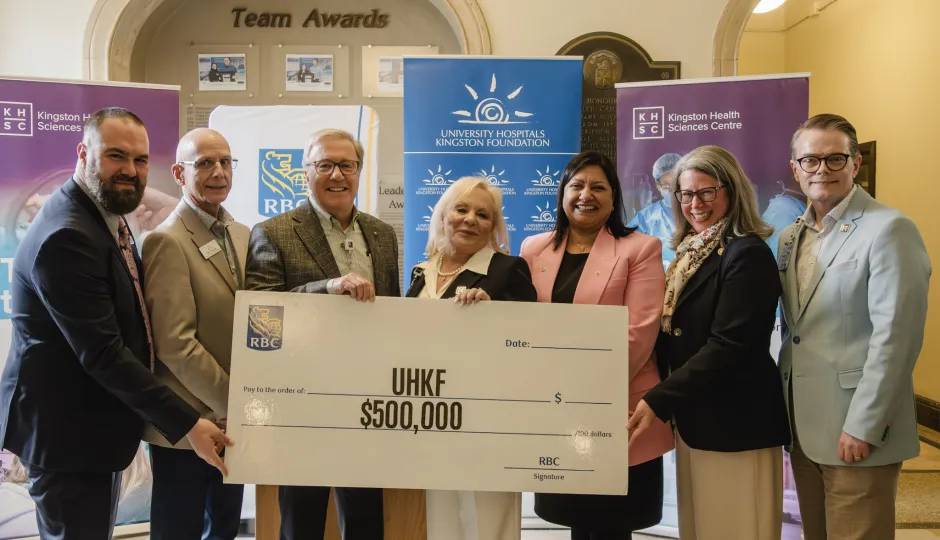 RBC, UHKF and KHSC executives holding a large cheque