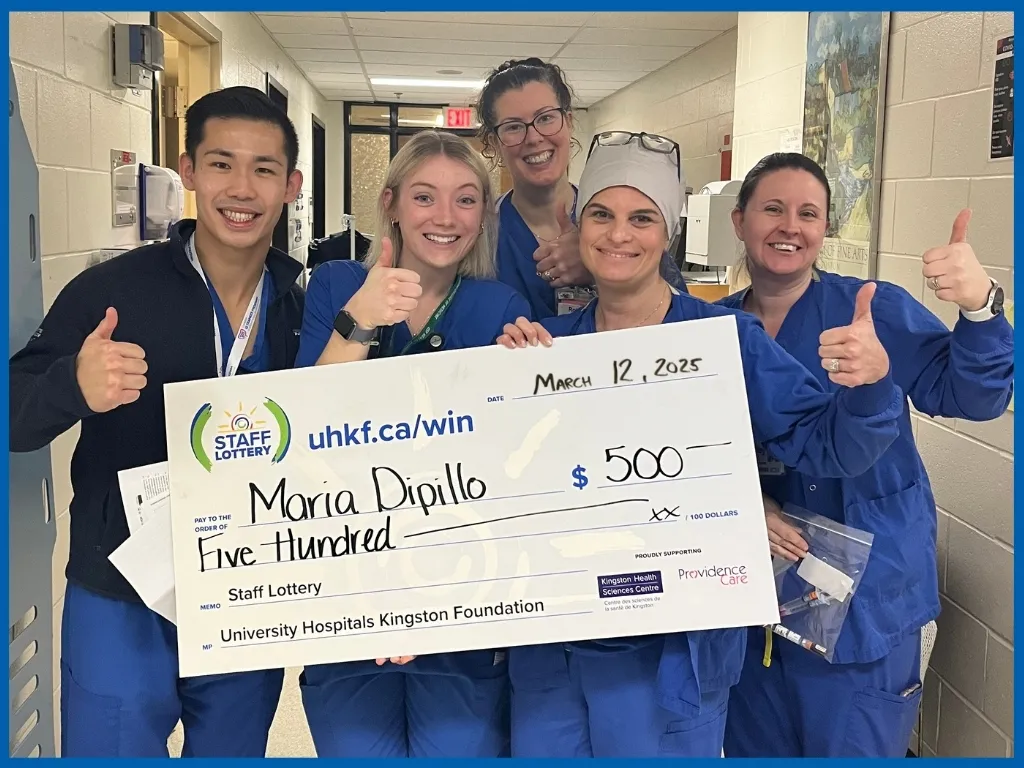Maria and other KHSC staff holding $500 chq March 12