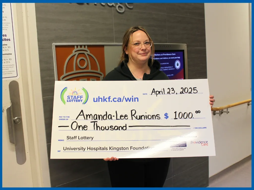 Amanda Lee $1000 Winner April 23 holding big chq.