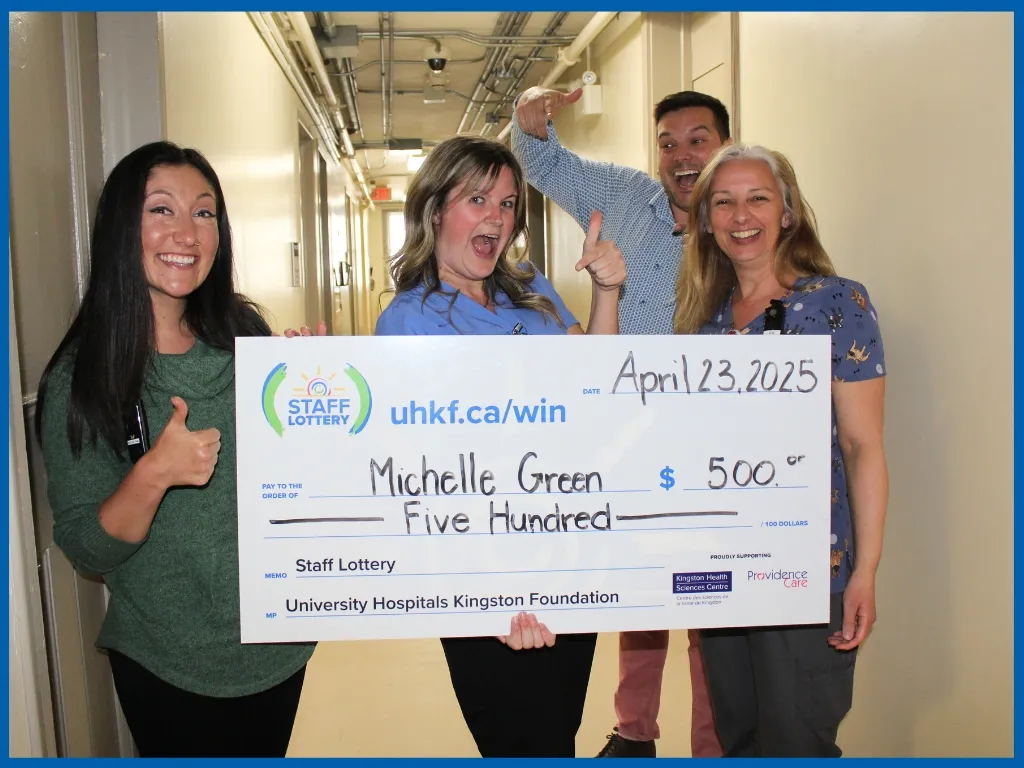 Michelle Green holding $500 big chq