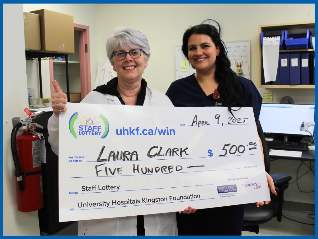 Laura Clark - April 9 $500 winner holding big chq.