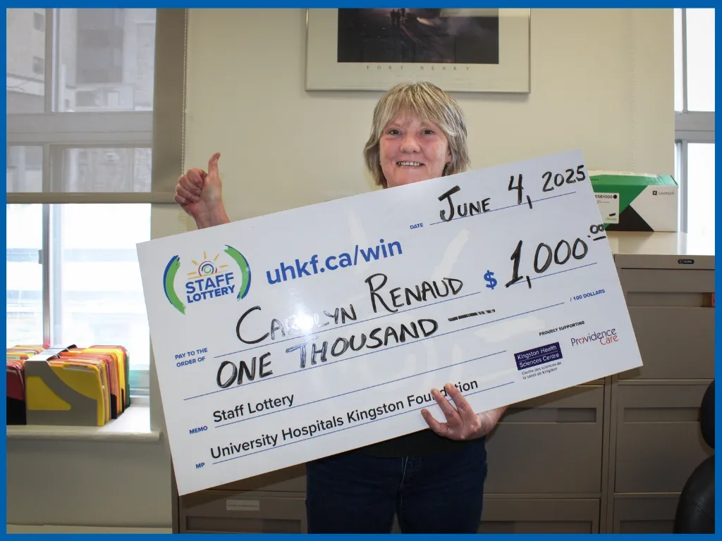 Winner Carolyn Renaud Holding Large Cheque