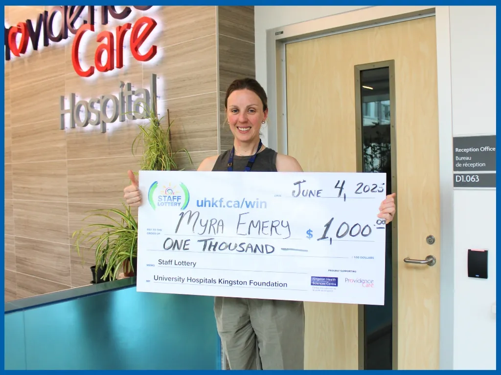 Winner Myra Emery Holding Large Cheque