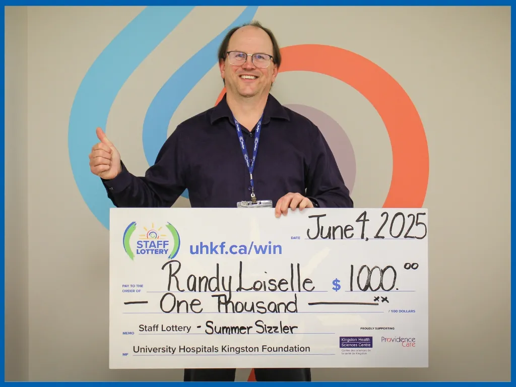 Winner Randy Loiselle Holding Large Cheque