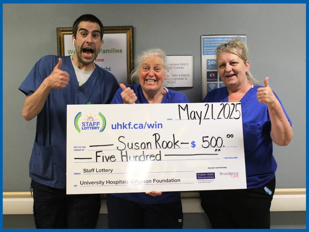 Susan Rook holding large cheque.