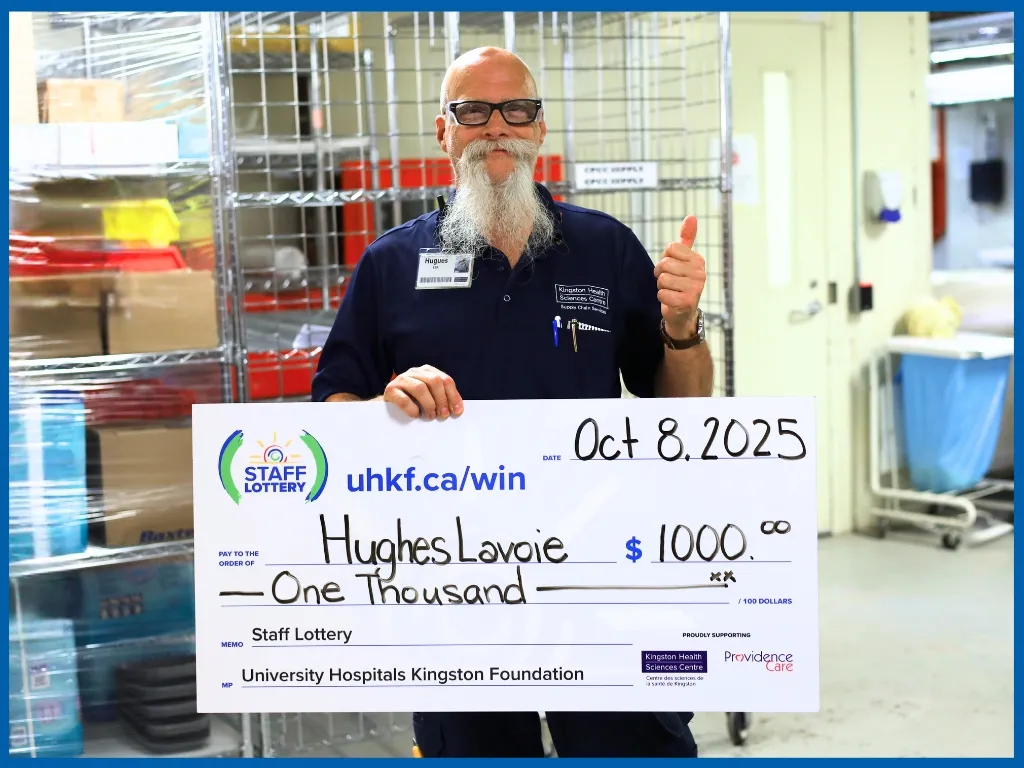 Winner Hughes Lavoie Holding Large Cheque