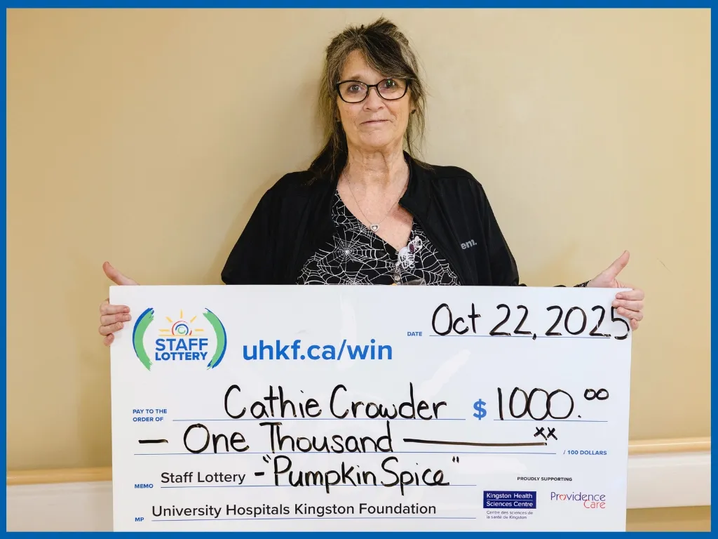 Winner Cathie Crowder Holding Large Cheque