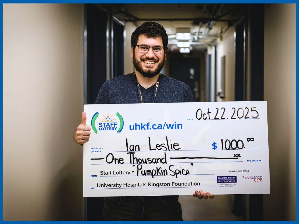 Winner Ian Leslie Holding Large Cheque