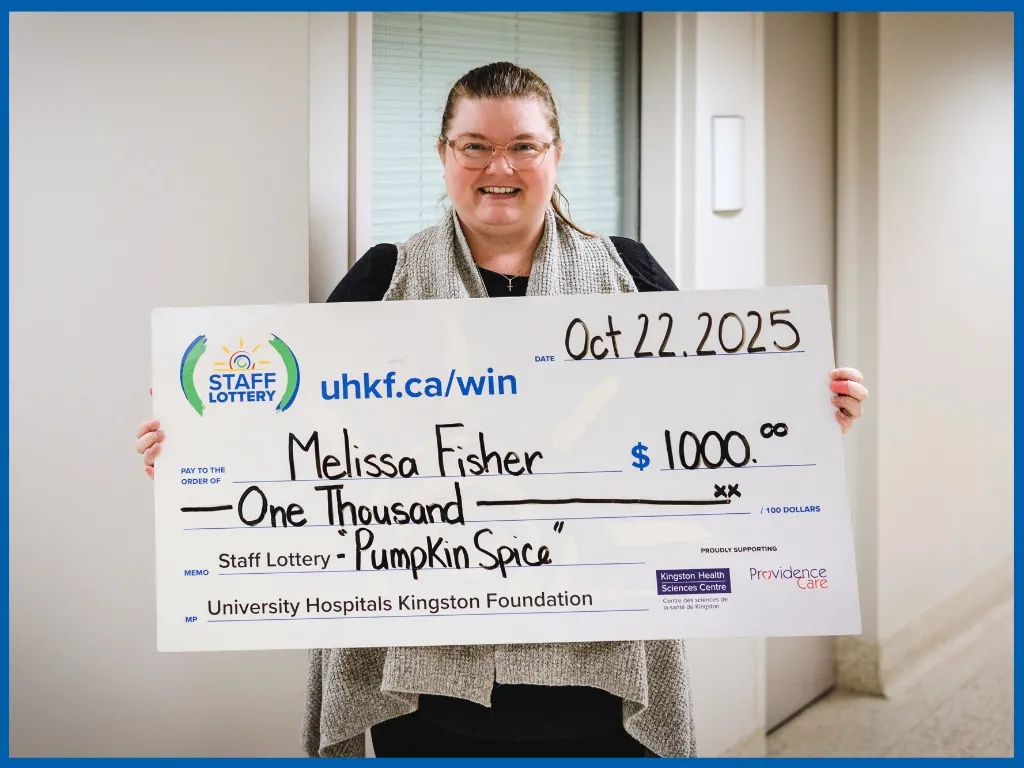 Winner Melissa Fisher Holding Large Cheque