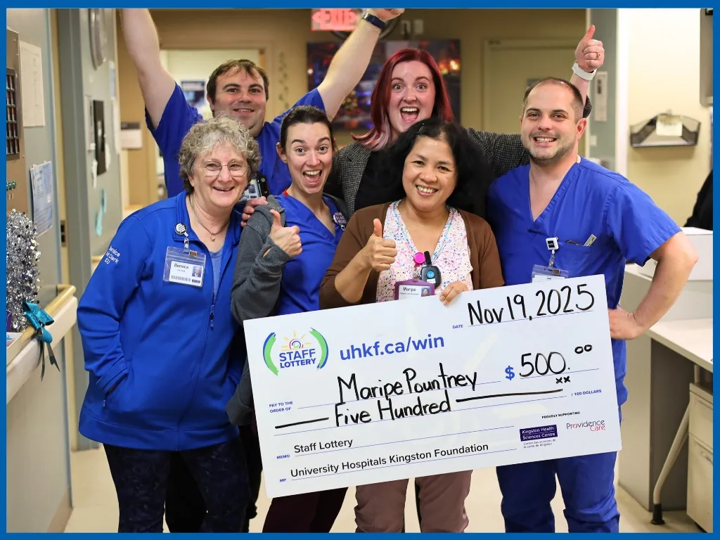 Maripe Pountney holding large cheque.