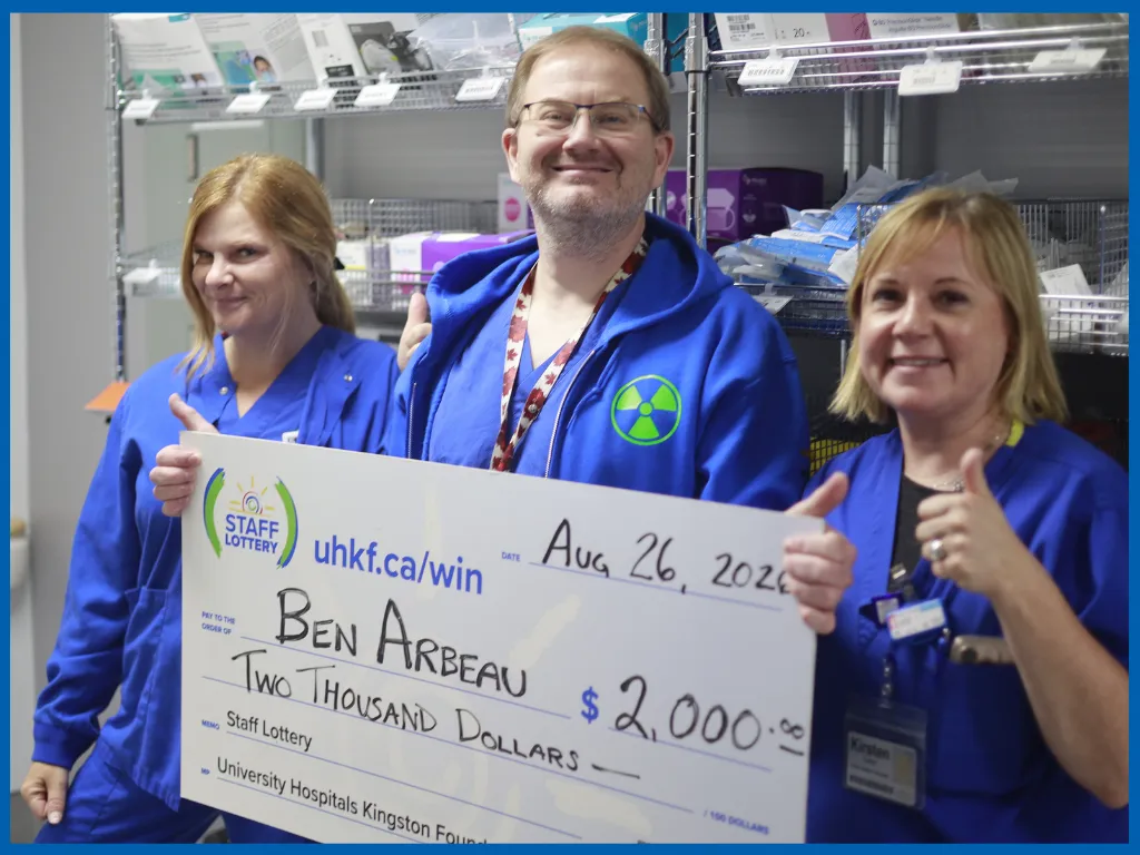 Ben Arbeau and team posing with a big cheque.