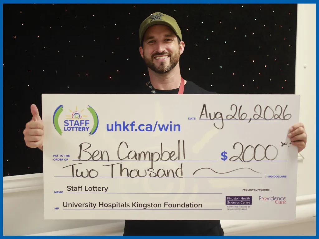 Ben Campbell posing with a big cheque.