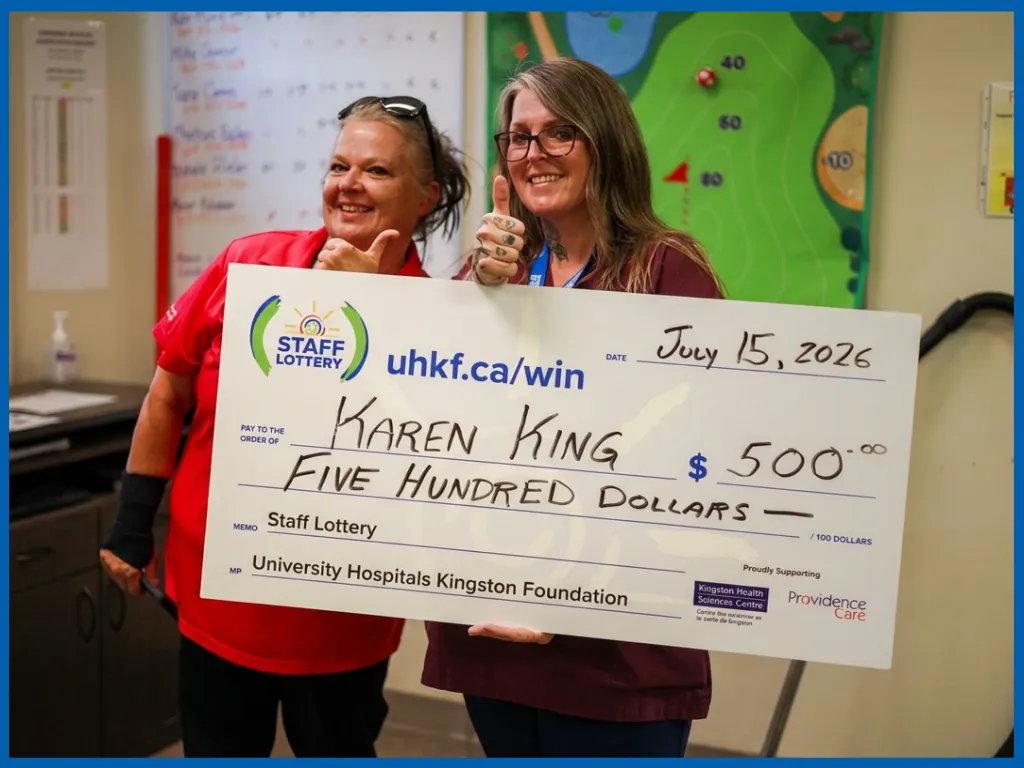 Karen King posing with a big cheque.