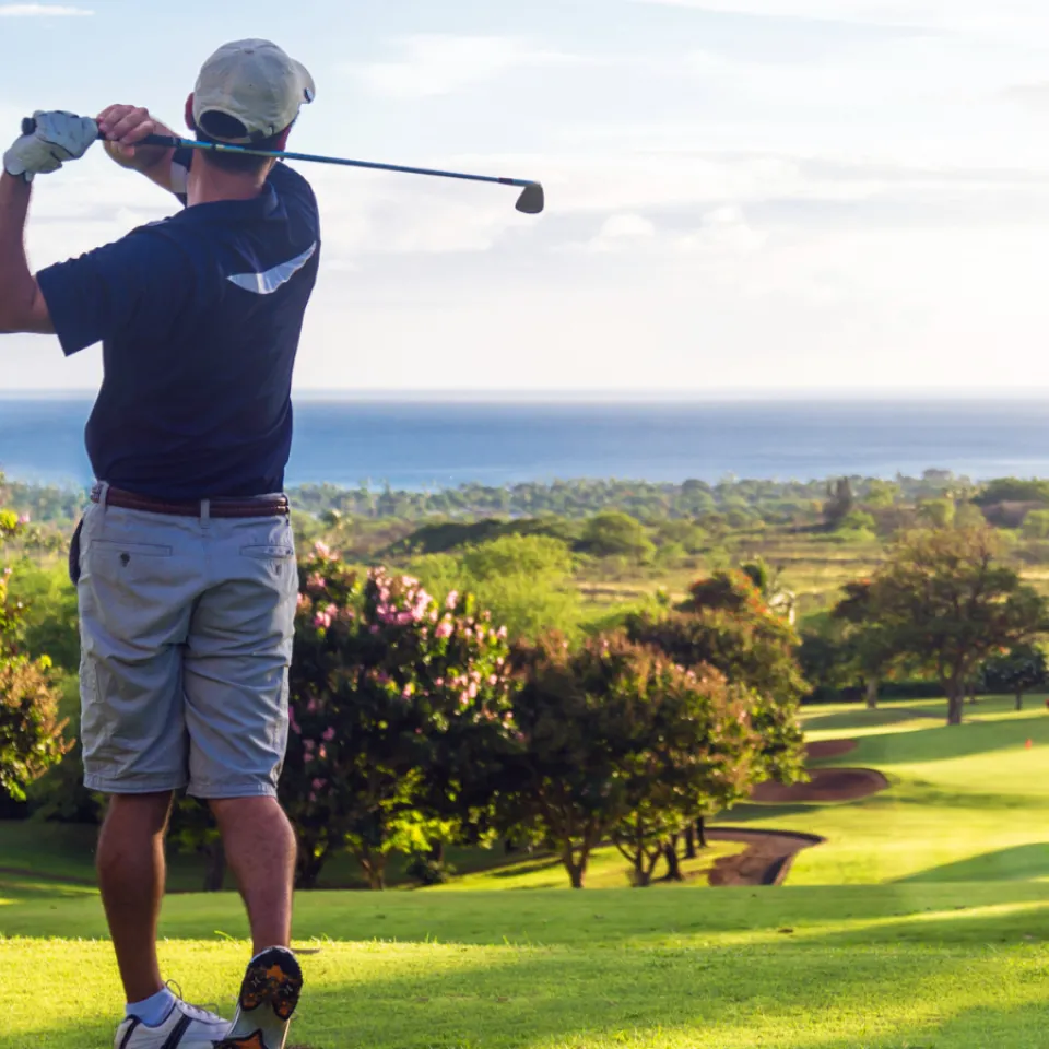 Man playing golf.