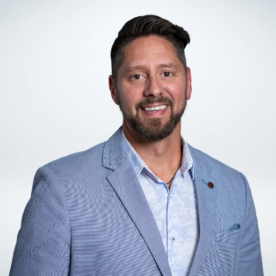 Headshot of Brent Atkinson wearing a light blue blazer and baby blue dress shirt.