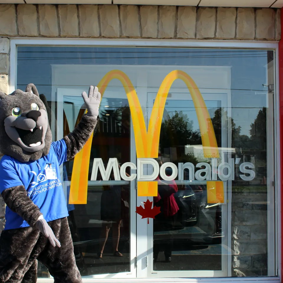 Asher standing outside of McDonalds