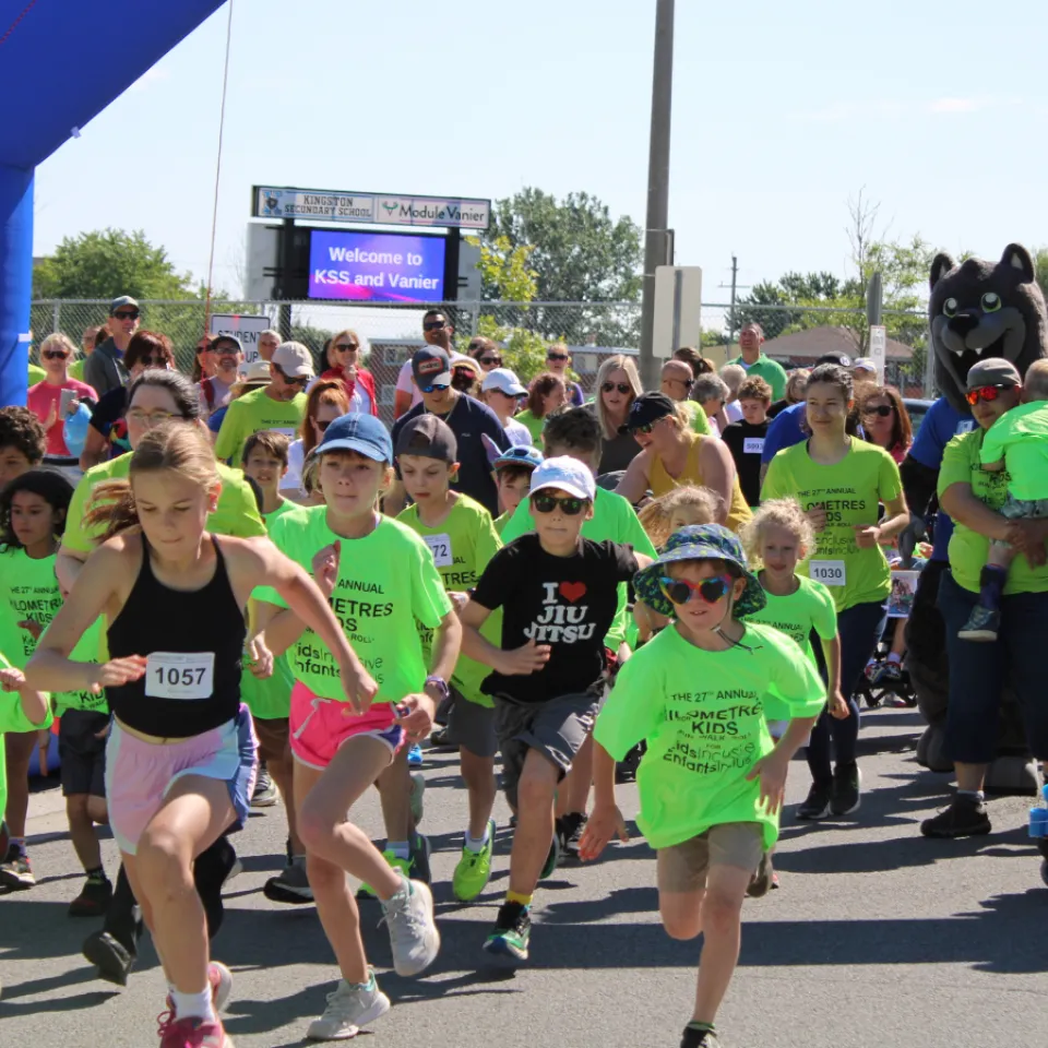 Kids in green t-shirts at Kilometres for Kids
