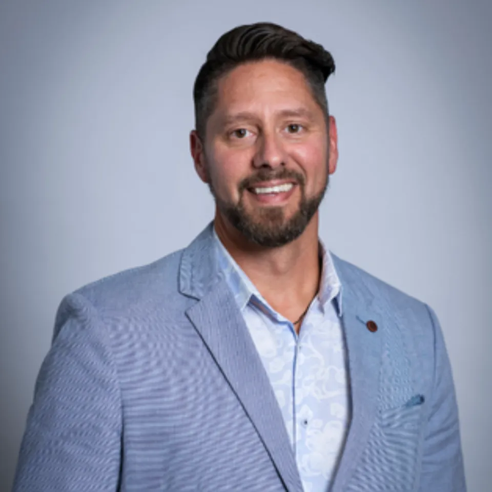 Headshot of Brent Atkinson wearing a light blue blazer and baby blue dress shirt.