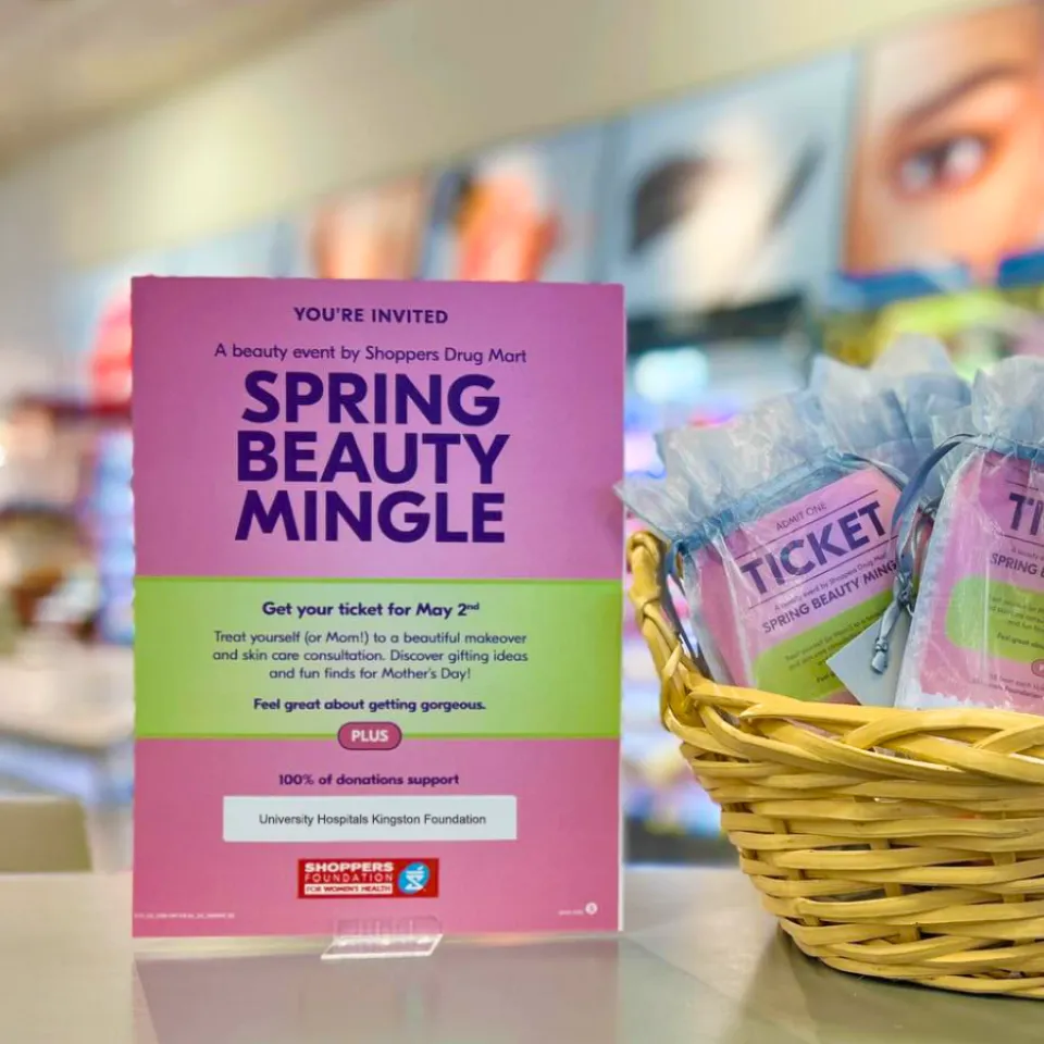 Shoppers Spring Beauty Mingle signage on desk at store.