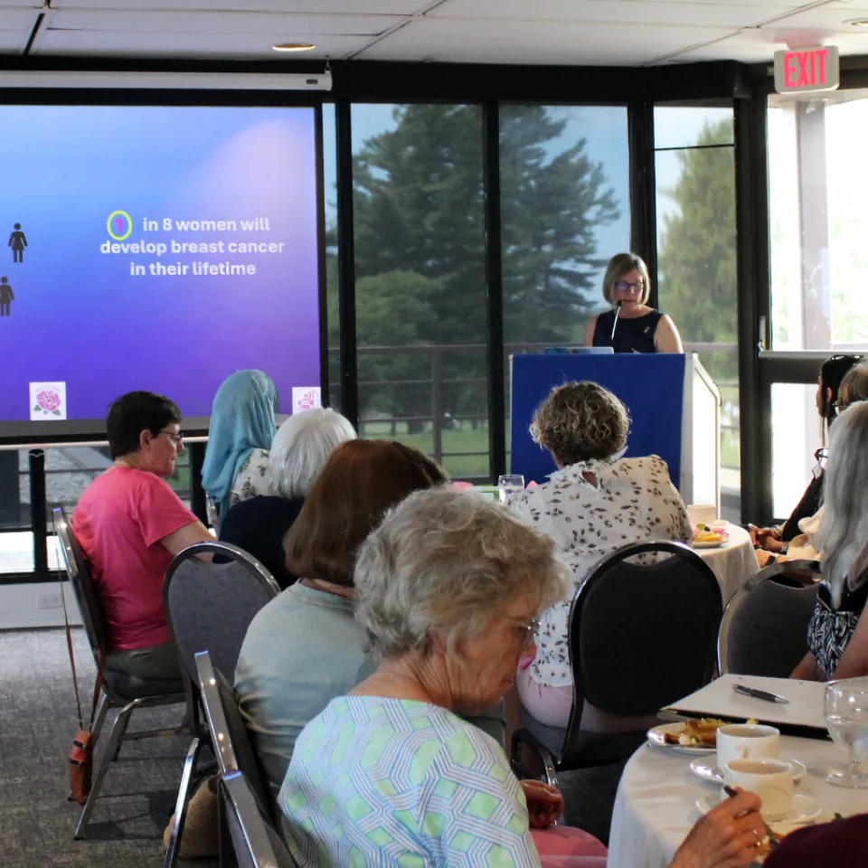 Dr. Doris Jans presenting at Women's Giving Circle luncheon.